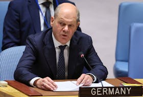 BERLIN (Reuters) - German Chancellor Olaf Scholz on Saturday called on the Polish government to clarify allegations about a cash-for-visas deal for migrants that has roiled Polish politics, as a