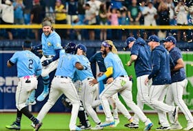 Rays batter Josh Lowe (second left) celebrates with teammates after hitting a walk-off RBI single in the ninth inning to defeat the Blue Jays 7-6 at Tropicana Field in St. Petersburg, Fla., Saturday, Sept. 23, 2023.