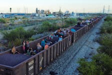 By Jose Cortes HUEHUETOCA, Mexico (Reuters) - Several dozen migrants retreated in frustration from train tracks outside Mexico City on Friday, blocked by Mexican officials from hitching rides on cargo