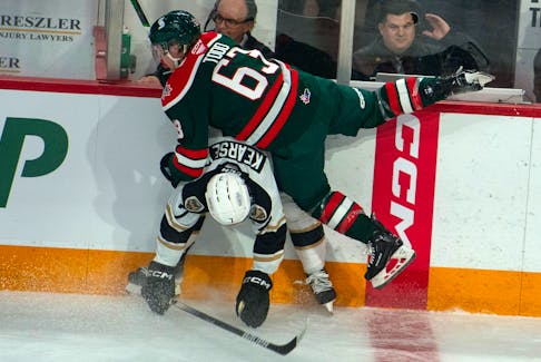 Charlottetown Islanders defenceman Marcus Kearsey checks Halifax Mooseheads centre Jake Todd during the first period of the Herd's home opener on Friday, Sept. 23, 2023. 
Ryan Taplin - The Chronicle Herald