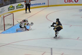 Charlottetown Islanders forward Alexis Michaud fires the puck past Halifax Mooseheads goaltender Jack Milner for a first-period goal on a penalty shot in a Quebec Major Junior Hockey League (QMJHL) game Sept. 23. Michaud would record four points in a 6-1 win over the Mooseheads in the Islanders’ home opener, played before over 3,100 fans at Eastlink Centre. Jason Simmonds • The Guardian