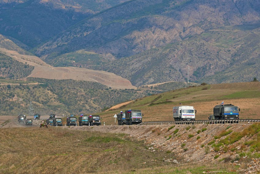 NEAR KORNIDZOR, Armenia (Reuters) - Russian peacekeepers will escort the homeless families of Nagorno-Karabakh Armenians to Armenia if they want, the ethnic Armenian authorities of the breakaway