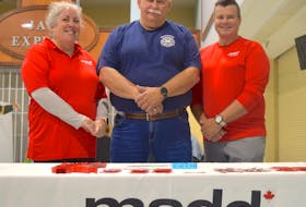 From left, Nita MacLean, MADD Cape Breton vice-president. Lloyd MacIntosh, chief of the North Sydney Volunteer Fire Department, and Rob Matheson, president of MADD Cape Breton, attend an appreciation breakfast for responders at Centre 200 in Sydney on Sunday. MacLean’s brother and his girlfriend were killed when a drunk driver struck their vehicle in 2004 and she says her family never recovered from the loss. CHRIS CONNORS/CAPE BRETON POST