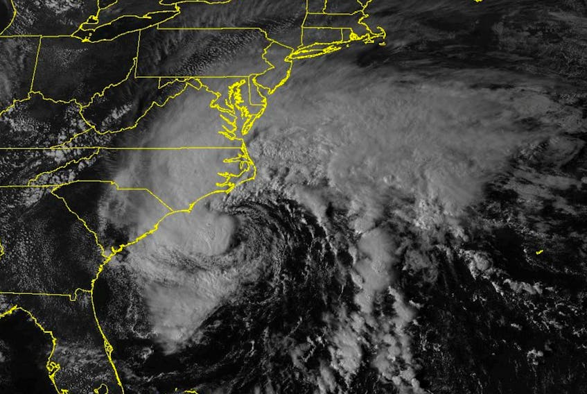 (Reuters) - Ophelia, downgraded to a post-tropical cyclone, brought more rain and wind as it moved along the Atlantic Coast of the United States, forecasters said on Sunday. The weather system came