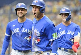 Toronto Blue Jays outfielder George Springer (centre) celebrates hitting a second-inning three-run inside the park home run against the Tampa Bay Rays.