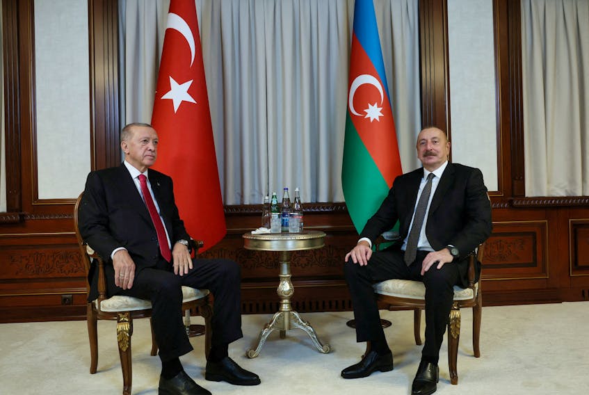 By Andrew Osborn and Nailia Bagirova (Reuters) - Azerbaijani President Ilham Aliyev hosted talks on Monday with his Turkish counterpart Tayyip Erdogan at which he hinted at the prospect of creating a