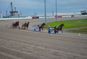 Phil Dorleans and Jason Hughes lead the field down the stretch in the opener of a 14-dash harness racing program at Red Shores Racetrack and Casino at the Charlottetown Driving Park on Sept. 23. Time of the mile was 1:56.1. Jason Simmonds • The Guardian