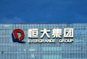 HONG KONG (Reuters) - Shares of China Evergrande plunged as much as 24% on Monday after the embattled developer said it was unable to issue new debt due to an ongoing investigation into one of its