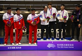 By Martin Quin Pollard and Dylan Martinez HANGZHOU, China (Reuters) - Three North Korean marksmen refused to join their South Korean rivals in a group photo of medal winners at the Hangzhou Asian