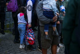 BERLIN (Reuters) - Germany plans to halve the federal aid it allocates for states to cover expenses of receiving and integrating refugees next year as part of budget-tightening amid soaring inflation