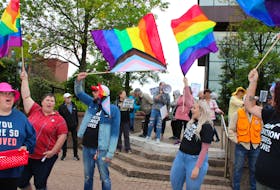 In back, people supporting the 1 Million March 4 Children chant into a megaphone calling for schools to stop teaching gender identity and sexual orientation at schools while a group of counter-protestors in front chant "Love not hate" outside City Hall on Wednesday. NICOLE SULLIVAN/CAPE BRETON POST