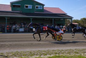 QTS Charlie and Redmond Doucet held off a late challenge from A Better Man and Adam Lynk to take the afternoon feature at Northside Downs in 1:59.1. CONTRIBUTED/CHRIS ABBASS