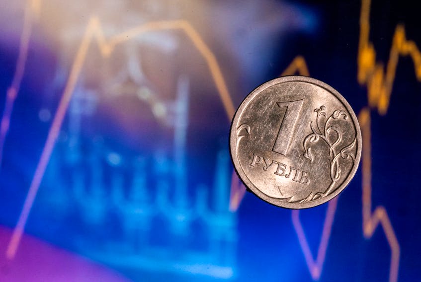 (Reuters) - The rouble firmed against the euro on Monday while trading little changed against the dollar, in a week when companies' need for roubles to settle end-of-month tax payments should lend the