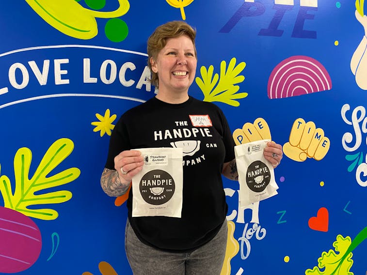 Sarah Bennetto O’Brien, owner of The Handpie Company, holds up a few sweet pies. On Sept. 22, she welcomed in tours to the second production facility in Borden-Carleton. – Kristin Gardiner/SaltWire