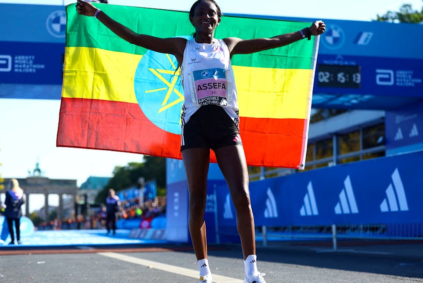 By Helen Reid LONDON (Reuters) - Adidas' newest running shoes, worn by Ethiopia's Tigist Assefa on Sunday to set a new women's marathon world record in Berlin, went on sale on Tuesday with an