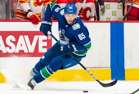 Vancouver Canucks' Ilya Mikheyev skates with the puck during NHL pre-season action against the Calgary Flames in Vancouver on Sept., 25, 2022. 