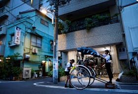 By Mariko Katsumura and Issei Kato TOKYO (Reuters) - Photo essay: Rickshaw puller Yuka Akimoto breathlessly dashes down the streets of Tokyo under a scorching summer sun, two French tourists enjoying