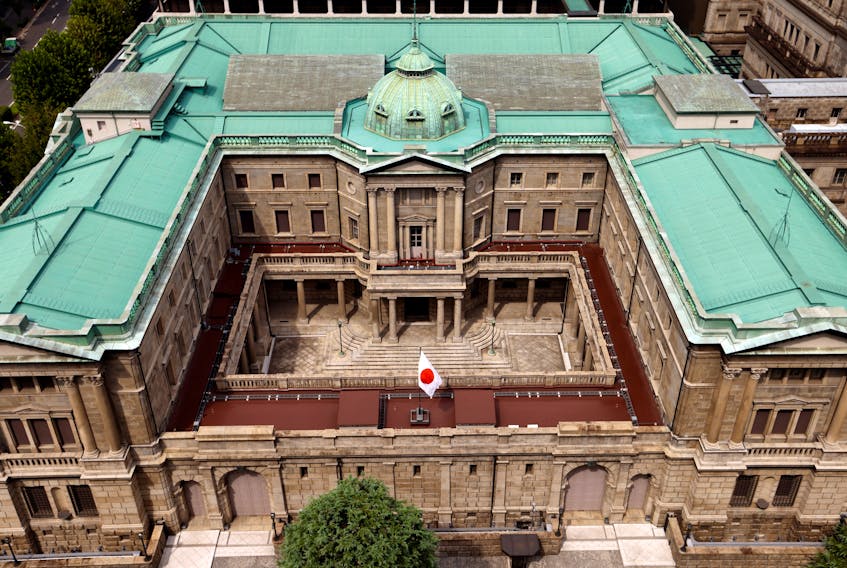 TOKYO (Reuters) - Bank of Japan policymakers agreed on the need to maintain ultra-loose monetary policy but were divided on how soon the central bank could end negative interest rates, minutes of its