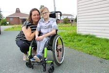 Crystal Singh, left, with her 11-year-old son Brett Costigan outside their home in River Ryan. Costigan is in Grade 6 at Breton Education Centre but hasn't been able to attend any classes as he isn't being provided a teaching assistant like he has been since he started school. NICOLE SULLIVAN/CAPE BRETON POST