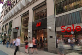 STOCKHOLM (Reuters) -H&M said unusually hot weather in many of its European markets had delayed the start of the autumn shopping season, sending sales lower in September, while cost cuts helped the