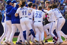 Matt Chapman #26 of the Toronto Blue Jays is mobbed by teammates after hitting a walk off RBI double to defaet the Boston Red Sox during the ninth inning in their MLB game at the Rogers Centre on September 17, 2023 in Toronto.