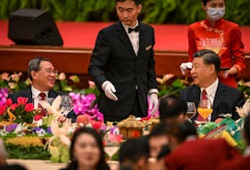 BEIJING (Reuters) - At a dinner reception before the 74th anniversary of the founding of modern China on Thursday, Chinese President Xi Jinping urged the nation to "work together in unity" in a speech