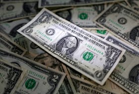 By Brigid Riley TOKYO (Reuters) - The dollar clung near a 10-month high against a basket of its peers on Thursday, keeping the yen under pressure near a key intervention zone as investors size up