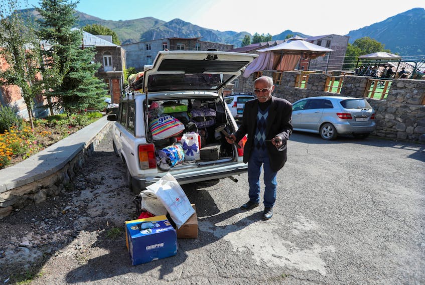 By Felix Light GORIS, Armenia (Reuters) - Albert Petrosyan strapped his son's wheelchair and a few bags to the roof of his ancient Russian-made car ahead of another long drive after fleeing his home