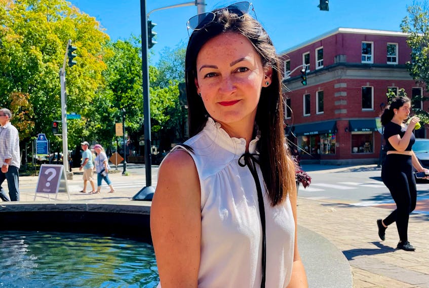Oksana Tesla, president of the Ukrainian Association of Fredericton, says her year-old organization is helping new arrivals from the eastern European Country adjust to life in the city and in Canada. Tesla is shown at Phoenix Square, near city hall. (Michael Staples, New Canadian Media)