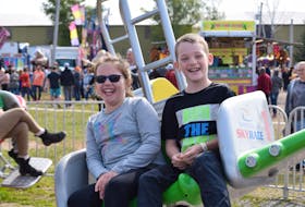 Autumn, 10, and Jayden Greeno, 9, from Beaverbank, had a good time riding on the Sky Race ride at the exhibition grounds in Windsor on Sept. 23.