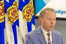Finance Minister Allan MacMaster presents a budget forecast update for Nova Scotia in Halifax on Thursday, Sept. 28, 2023.