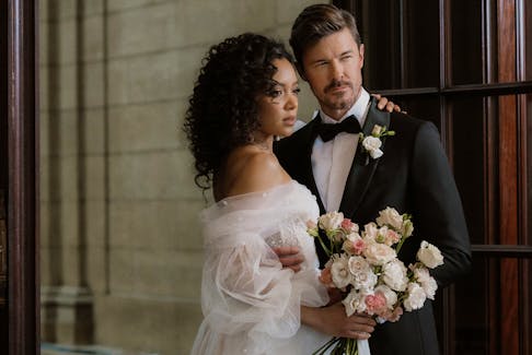 Jeremy Irving (right) with fellow model, Michelle Youssef (left). He said he was blown away when he found out the wedding editorial shoot her did was picked up by British Vogue for their fall edition. Cremeux Photo