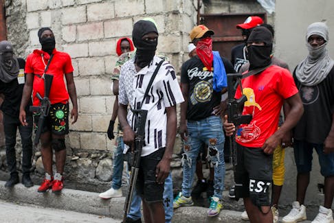 Security for former police officer Jimmy (Barbecue) Cherizier march against Haitian Prime Minister Ariel Henry in Port-au-Prince, Haiti on Sept. 19, 2023. The Dominican Republic, Haiti's neighbour, shut down its border, driving Haitian migrants back into areas of conflict and calling into question access to humanitarian aid.
