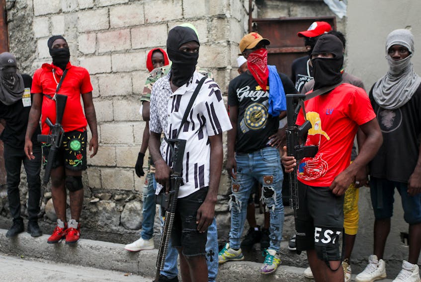 Security for former police officer Jimmy (Barbecue) Cherizier march against Haitian Prime Minister Ariel Henry in Port-au-Prince, Haiti on Sept. 19, 2023. The Dominican Republic, Haiti's neighbour, shut down its border, driving Haitian migrants back into areas of conflict and calling into question access to humanitarian aid.