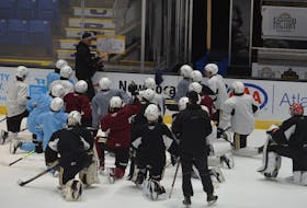 Charlottetown Islanders general manager and head coach Jim Hulton explains a drill during a recent practice at Eastlink Centre with the Quebec Major Junior Hockey League team. Jason Simmonds • The Guardian