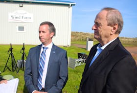 Maritime Electric CEO Jason Roberts, left, and Egmont MP Robert Morrissey speak with reporters in Summerside on Sept. 29, 2023. Morrissey announced a federal contribution of $19 million to a $47.6-million (total) smart meter upgrade program Maritime Electric will be rolling out to P.E.I. customers over the next three to four years. Colin MacLean