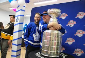 The Stanley Cup was taken on a tour of Cape Breton on Friday and included a stop at the Breton Ability Centre where longtime Toronto Maples Leafs fans Lance Squires, left, and Wesley MacLean posed with the National Hockey League's championship trophy. MacLean from Port Hood was especially excited to touch the cup. He also hugged and kissed the trophy. A free community celebration was also scheduled to take place at the Cape Breton University courtyard near the Canada Games Complex from 3-7 p.m. on Friday. The cup's appearance is part of Kraft Hockeyville celebrations this weekend. GREG MCNEIL/CAPE BRETON POST