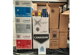Justice and Public Safety peace officers seized 137,000 cigarettes, 75 flavoured cigars and five cans of chewing tobacco during a traffic stop in Allardville, N.B. on Sept. 21. - Contributed