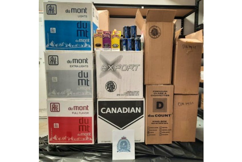 Justice and Public Safety peace officers seized 137,000 cigarettes, 75 flavoured cigars and five cans of chewing tobacco during a traffic stop in Allardville, N.B. on Sept. 21. - Contributed