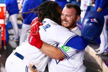 Alejandro Kirk of the Blue Jays celebrates with Vladimir Guerrero Jr. after hitting a home run against the Tampa Bay Rays at Rogers Centre on September 29, 2023 in Toronto.