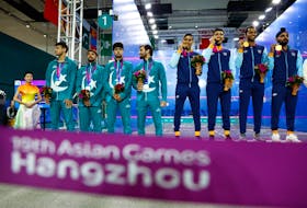 By Martin Quin Pollard HANGZHOU, China (Reuters) - India's squash team celebrated a gold medal gained in dramatic circumstances on Saturday when Abhay Singh came back from two match points down to win