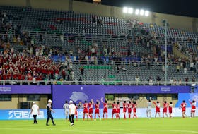 By Michael Church HANGZHOU, China (Reuters) - North Korea struck three late goals to secure a 4-1 win over neighbours South Korea on Saturday and progress to the semi-finals of the Asian Games women's