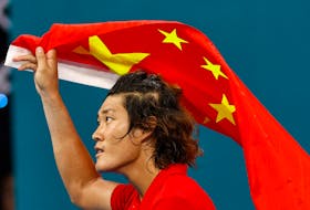 HANGZHOU, China (Reuters) - Chinese tennis trailblazer Zhang Zhizhen claimed the nation's first men's singles gold medal at the Asian Games in nearly 30 years on Saturday, riding a wave of crowd