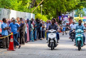 By Mohamed Junayd MALE (Reuters) - Voters lined up at hundreds of polling stations in the Maldives on Saturday in a run-off election for president of the Indian Ocean archipelago that pits the