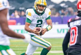 Edmonton Elks quarterback Tre Ford runs with the ball against Calgary Stampeders during the first half of the Labour Day Classic at McMahon Stadium on Monday, Sept. 4, 2023. 
