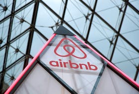 The Airbnb logo is displayed under the glass Pyramid of the Louvre museum in Paris. HRM is not making it an immediate priority to punish people who offer short-term rentals that violate the city's new regulations. - REUTERS/Charles Platiau
 
