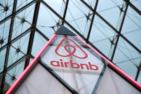 The Airbnb logo is displayed under the glass Pyramid of the Louvre museum in Paris. HRM is not making it an immediate priority to punish people who offer short-term rentals that violate the city's new regulations. - REUTERS/Charles Platiau
 