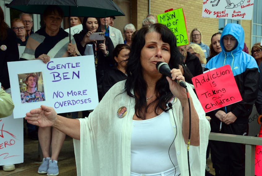 Tina Olivero speaks at a rally in front of Confederation Building Wednesday. Attendees at the rally were demanding more help for people with addictions in the province. Olivero’s son died of a drug overdose.

Keith Gosse/The Telegram