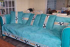 Replacing a couch at her seaside cottage in Heart's Content was a complicated task, so Janice Wells opted to get creative instead. The colours of her new ‘soft and non-slip corn velvet sofa cover’ are even more vibrant than the photo shows, she says. - Janice Wells