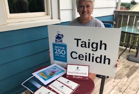 Ship Hector Society secretary Darlene MacDonald displays some of the Gaelic signage that will be in place for the 250th anniversary of the ship’s landing, Sept. 14-17. Rosalie MacEachern